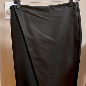 Alice and Olivia black skirt. Wool with leather. Wrap style. Knee length…